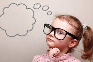 little girl with big glasses (at YESnick Vision Center our opticians fit kids right!)
